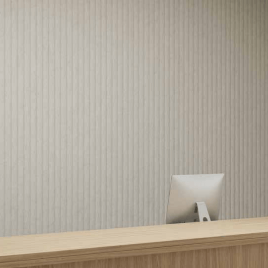 Acoufelt QuietForm™ 3D Debossed Acoustic Tiles "Celestial" on a soothing reception wall, enhancing sound management and aesthetic.