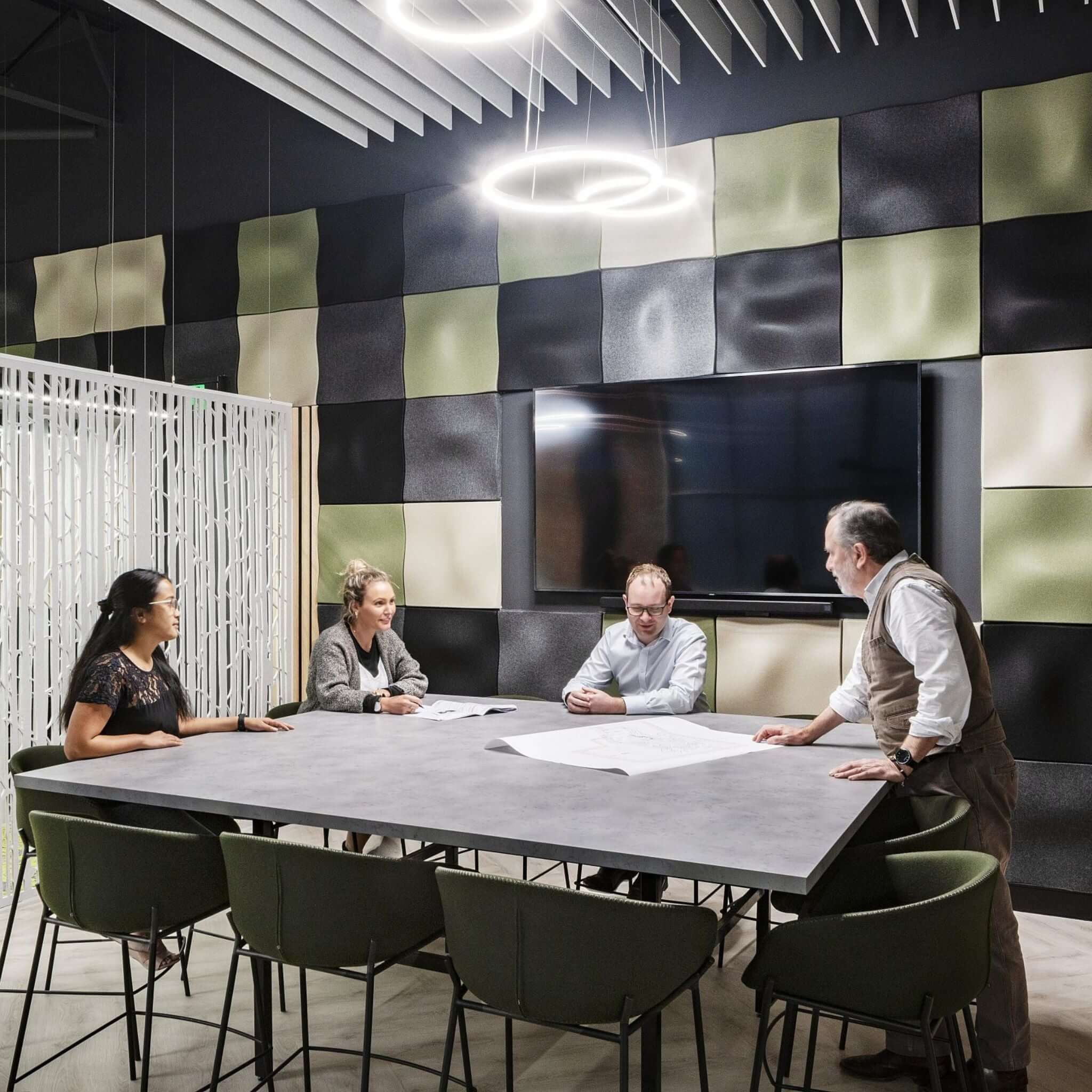 Meeting room featuring Autex 3D Acoustic Wall Tiles, enhancing aesthetics and sound management in a modern workspace.