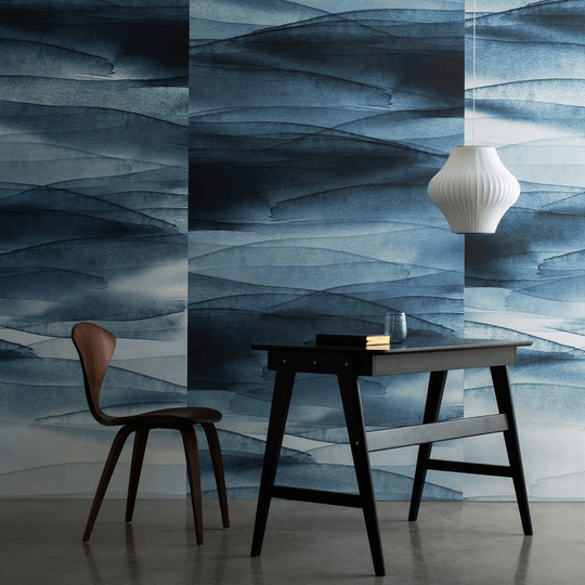 Modern workspace featuring Autex Emma Hayes Collection acoustic panels in blue tones, with a stylish chair and pendant light.