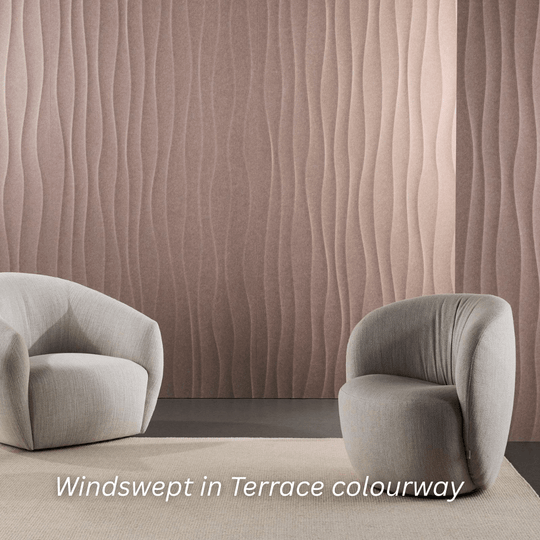 Windswept wall texture in Terrace colourway behind two modern, curved armchairs in a stylish interior.