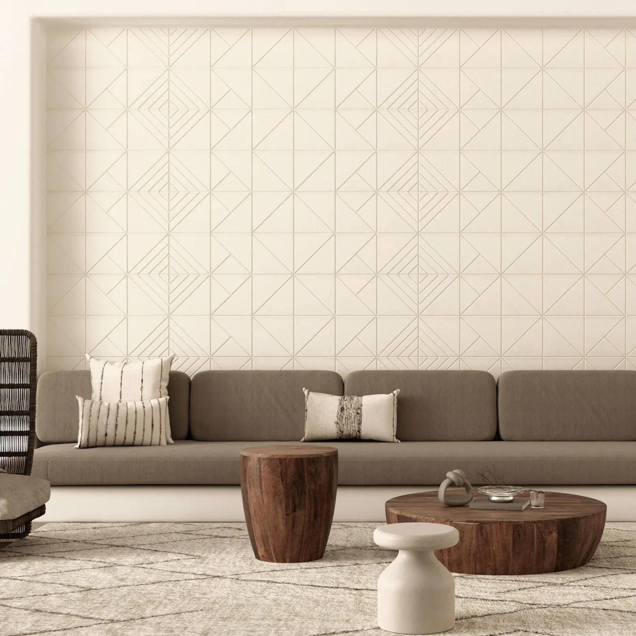 Stylish living room featuring acoustic panels, comfortable seating, and wood accent tables for soundproofing.