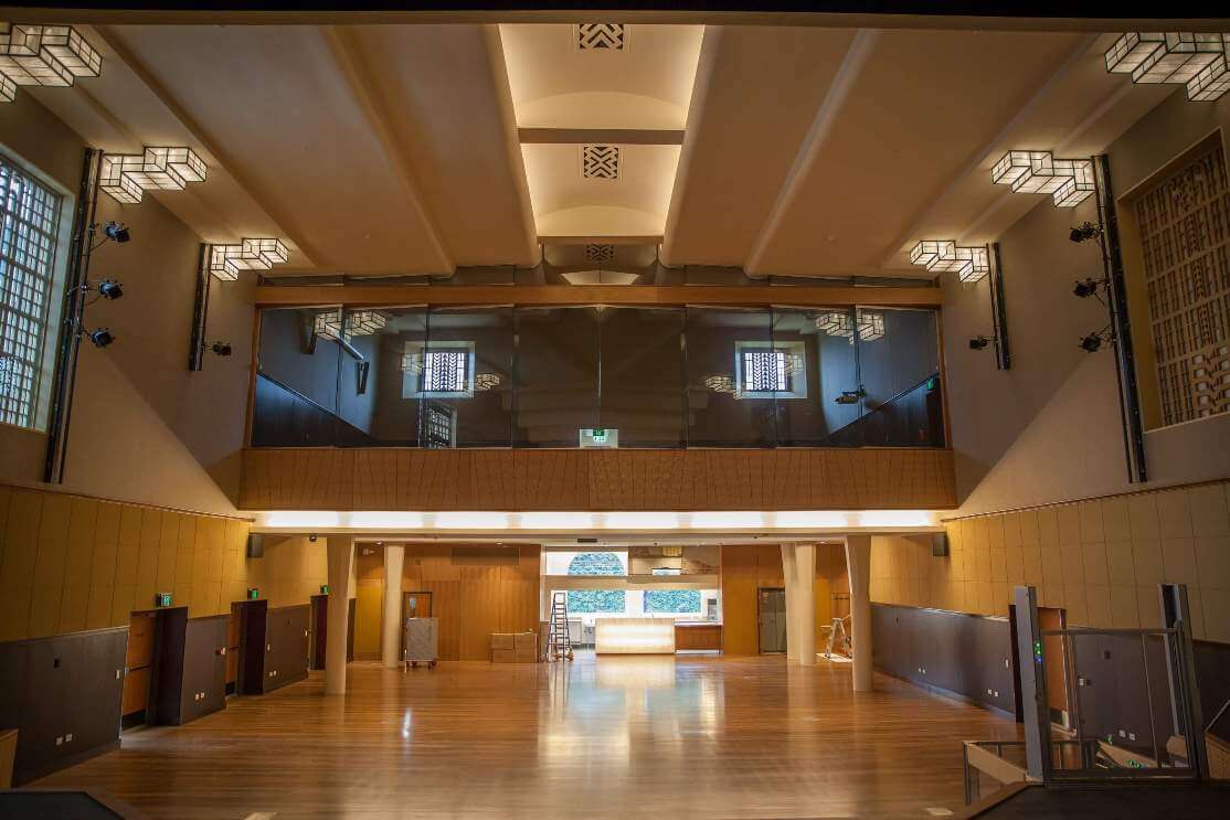 Modern community hall interior with acoustic panels, featuring welcoming design for gatherings and events.