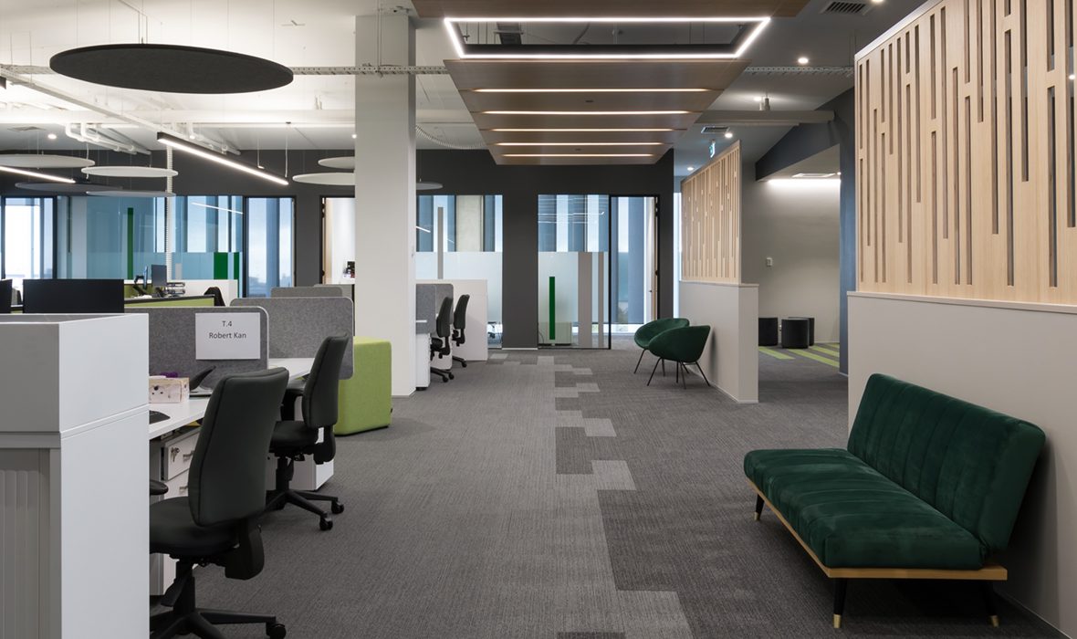 Modern office layout featuring acoustic panels for soundproofing and enhanced focus in workspaces.