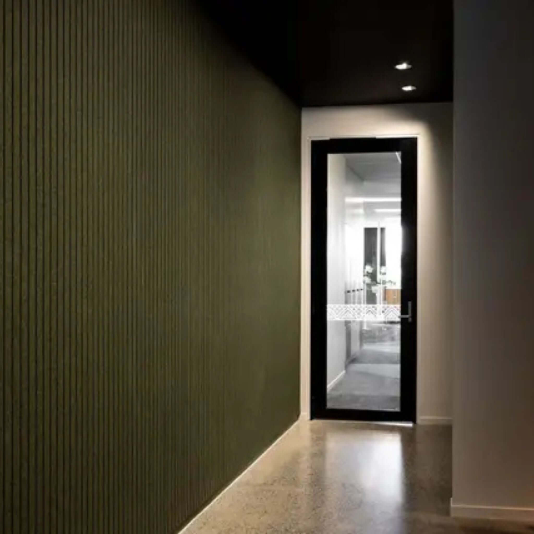 Groove Acoustic Panels in a modern hallway, showcasing stylish soundproofing and contemporary design.