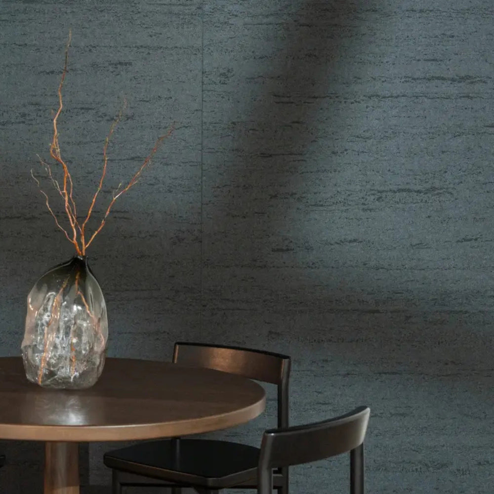 Modern dining space featuring Autex Mirage™ textured panel wall with a sleek table and decorative vase.