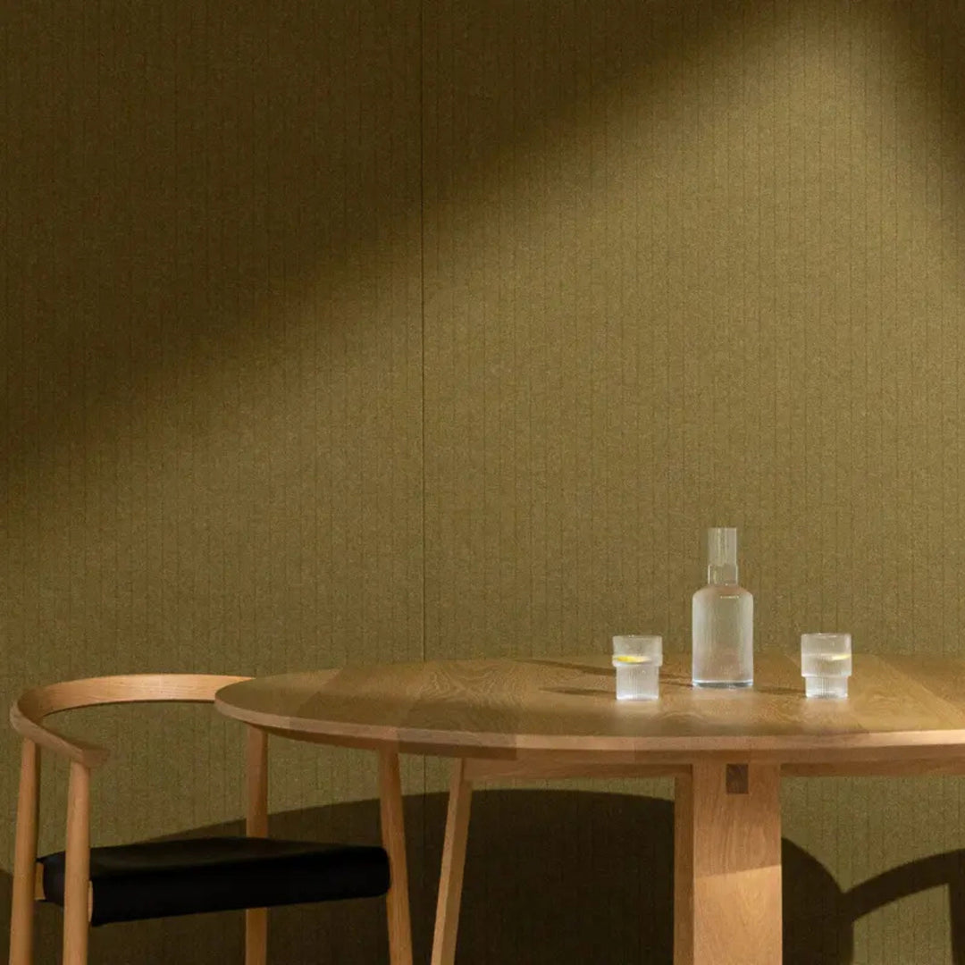 Autex Mirage™ textured panel in a minimalist interior setting, featuring a wooden table and glassware.