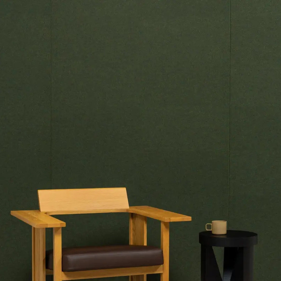 Autex Mirage™ textured panel in a modern workspace with wooden chair and side table.