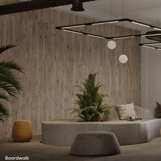 Modern interior featuring Acoufelt WoodBeQuiet™ acoustic wall planks in Boardwalk with plants and seating area.