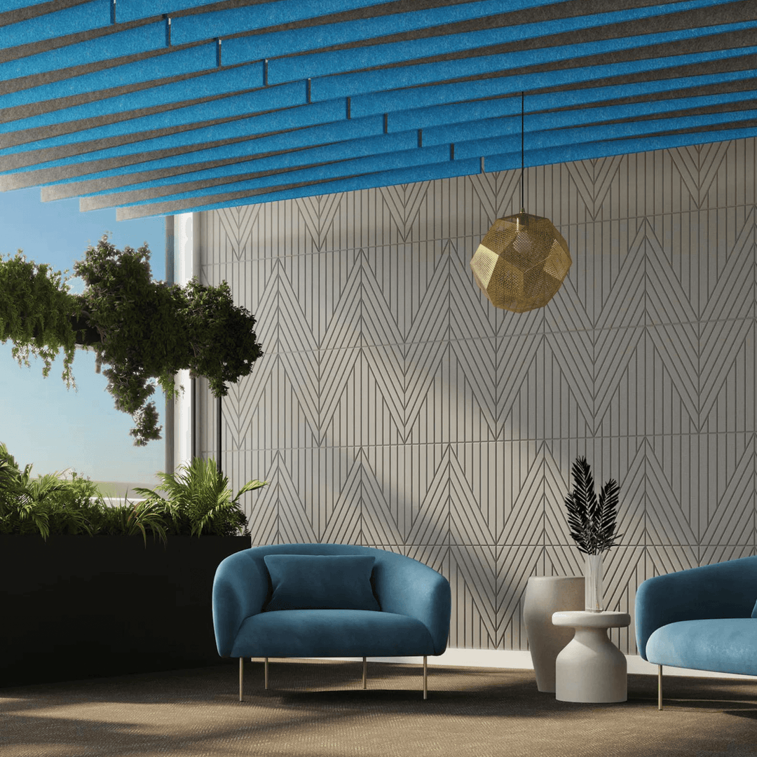 Modern interior featuring Acoufelt Fracture Acoustic Tiles with blue accents and stylish furniture for sound management.