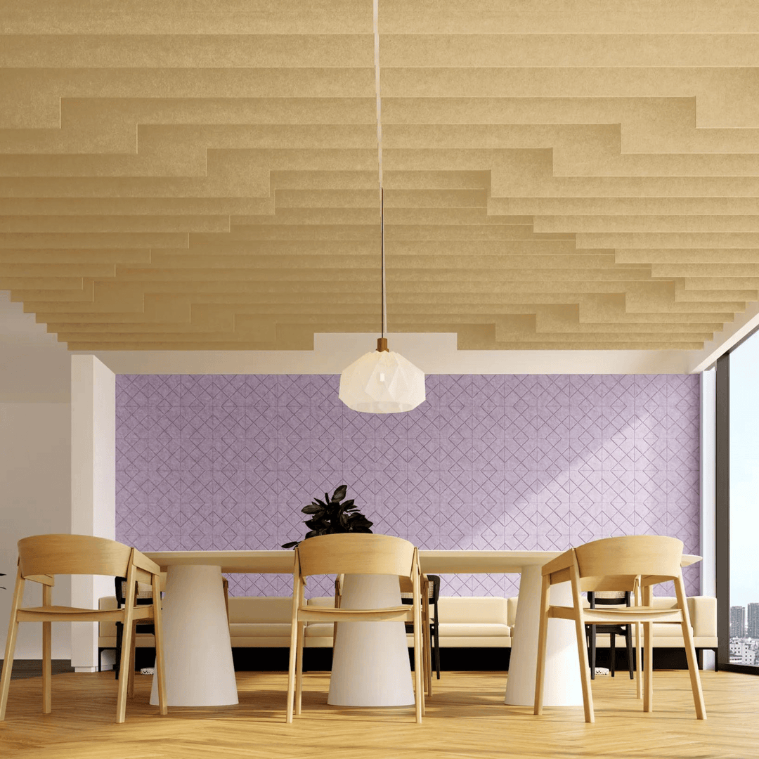 Modern interior with Acoufelt Fracture Acoustic Tiles on the ceiling, featuring a stylish workspace and pastel wall design.