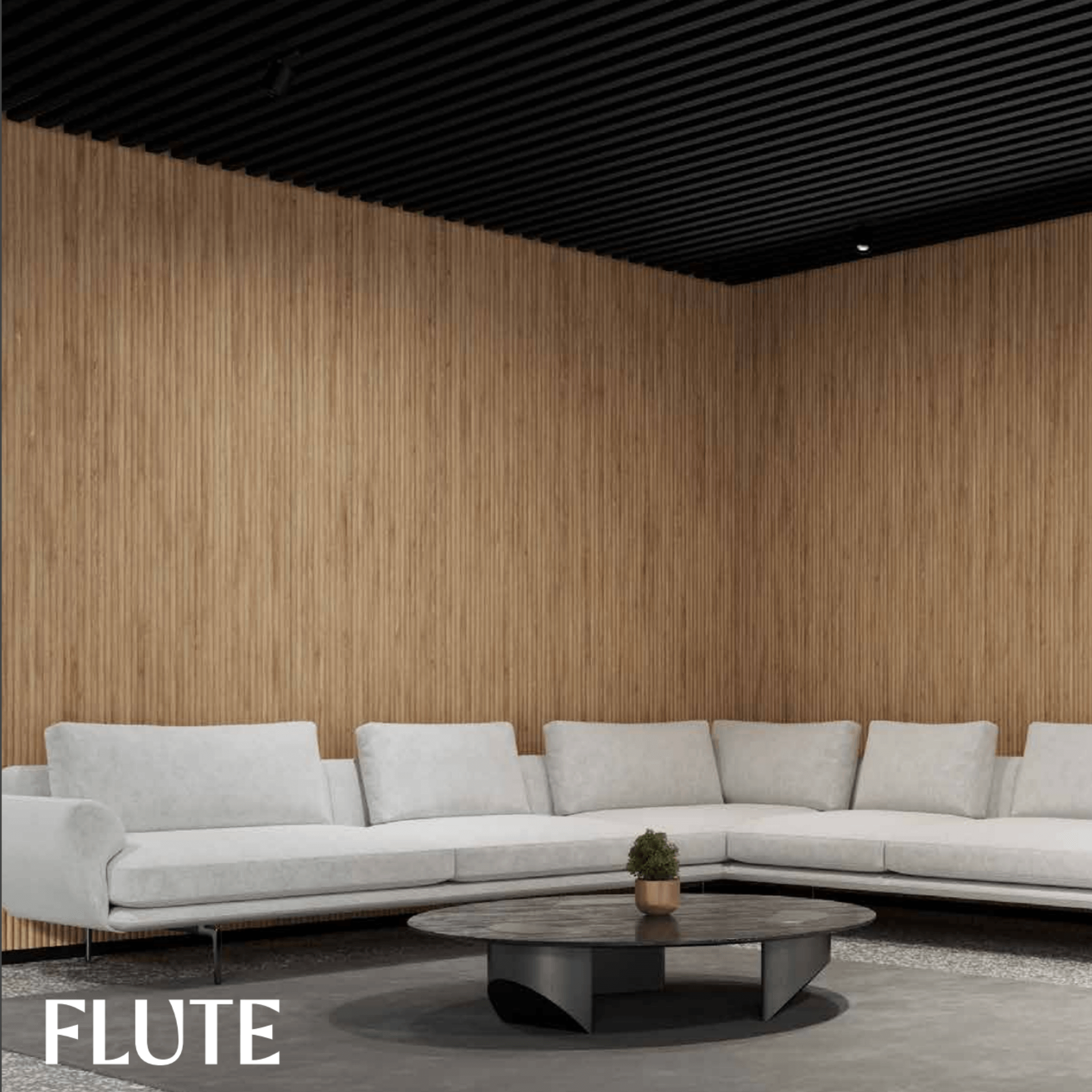 Acoufelt QuietForm 3D Debossed Acoustic Tiles "Flute" in a modern living room setting with a light gray couch.