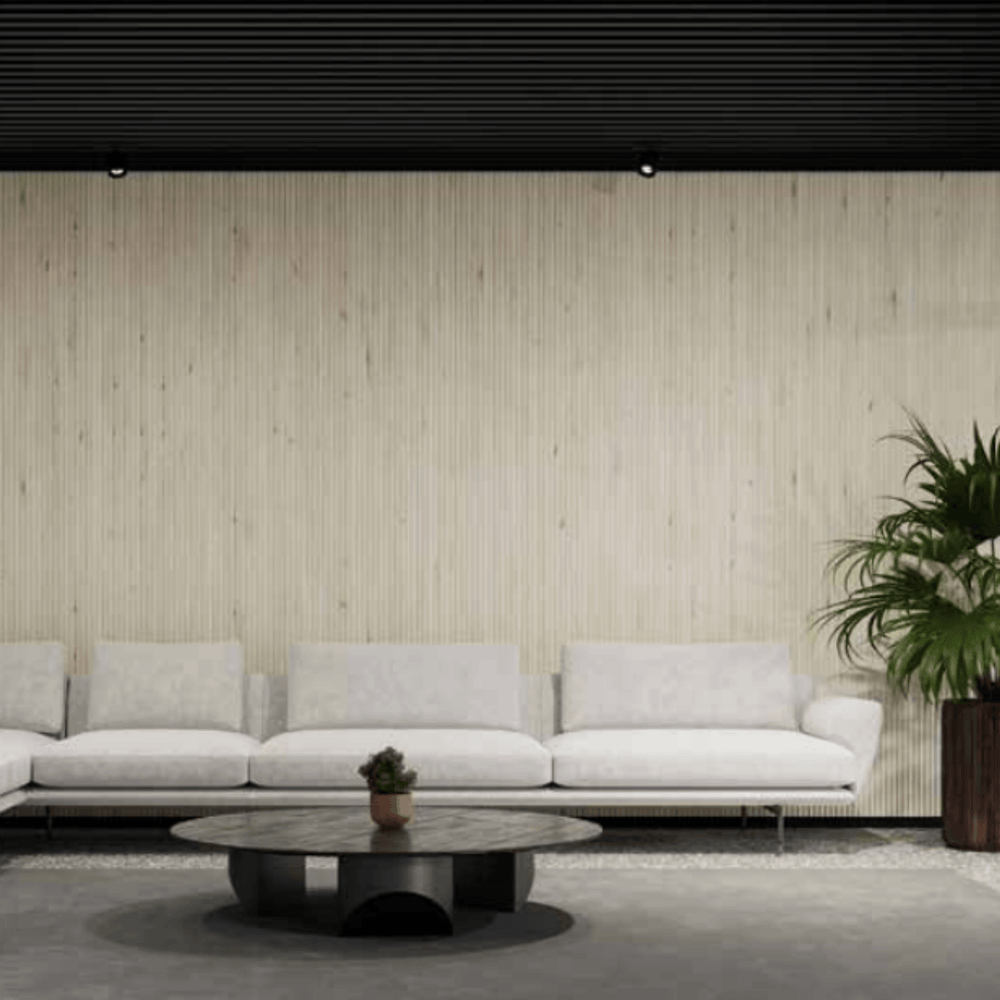 Acoufelt QuietForm™ 3D Debossed Acoustic Tiles "Flute" featured on a modern interior wall with a minimalist sofa.