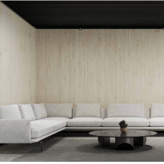 Acoufelt QuietForm™ 3D Debossed Acoustic Tiles "Flute" featured in a modern living room with a sleek couch and coffee table.