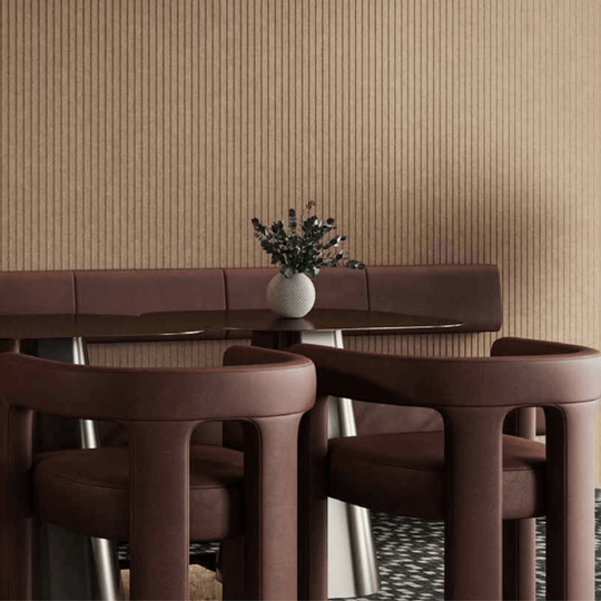 Acoufelt QuietForm™ 3D Debossed Acoustic Tiles "Pole" enhancing a modern interior with stylish brown seating and decorative vase.