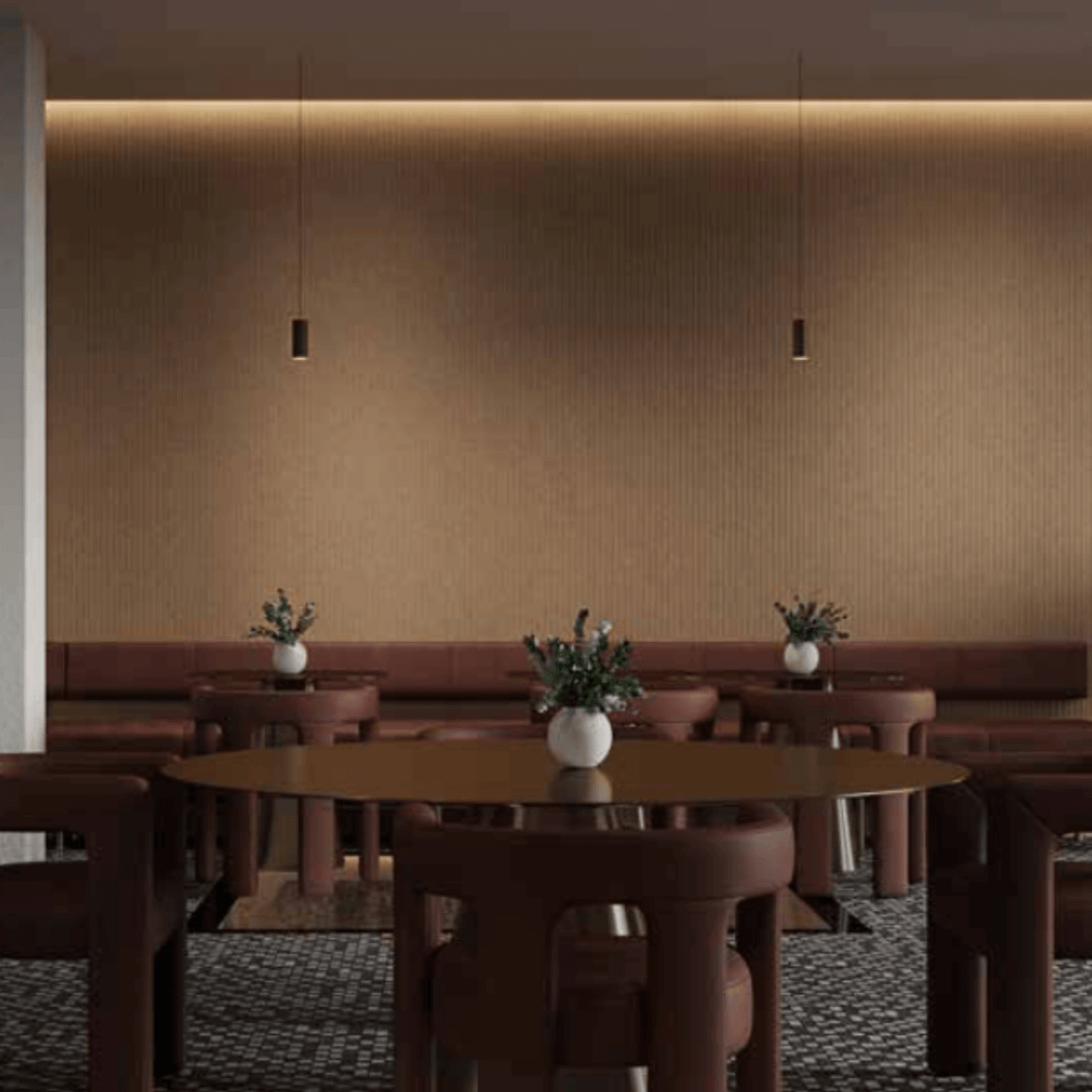 Acoufelt QuietForm™ 3D debossed acoustic tiles in a modern interior setting with stylish furniture and warm lighting.