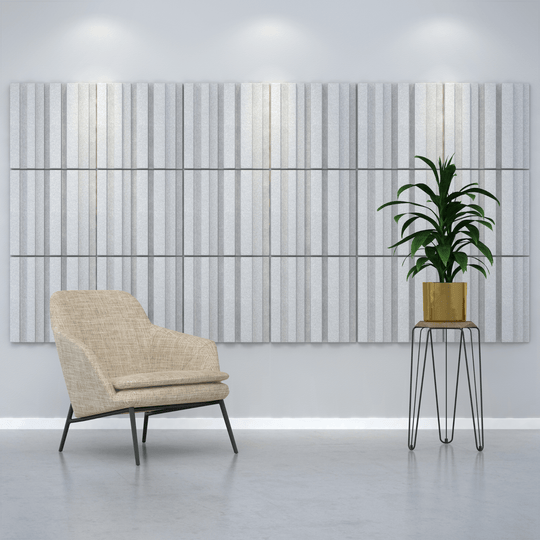 Acoustek Newport Collection acoustic wall tiles in a modern interior with a chair and potted plant, enhancing sound and style.