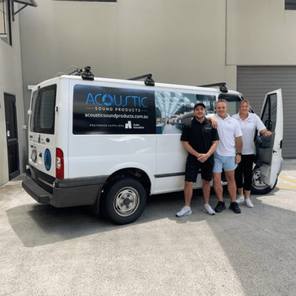 Team members standing beside an Acoustic Sound Products van outside their facility in Australia.