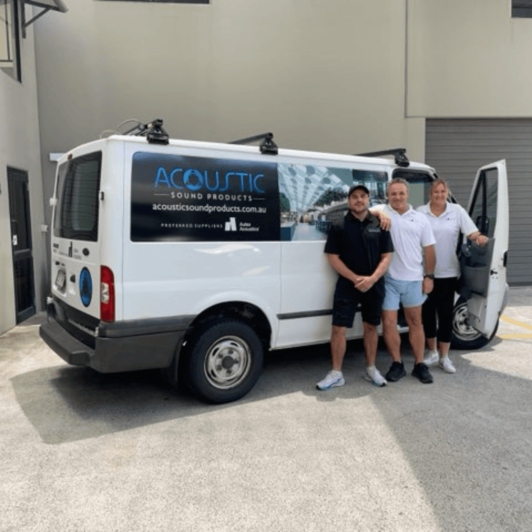 Team members standing beside an Acoustic Sound Products van outside their facility in Australia.