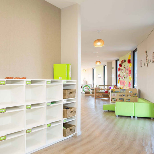 Bright interior of a playroom featuring storage shelves and colorful seating, enhanced by Autex Composition® Acoustic Panels.