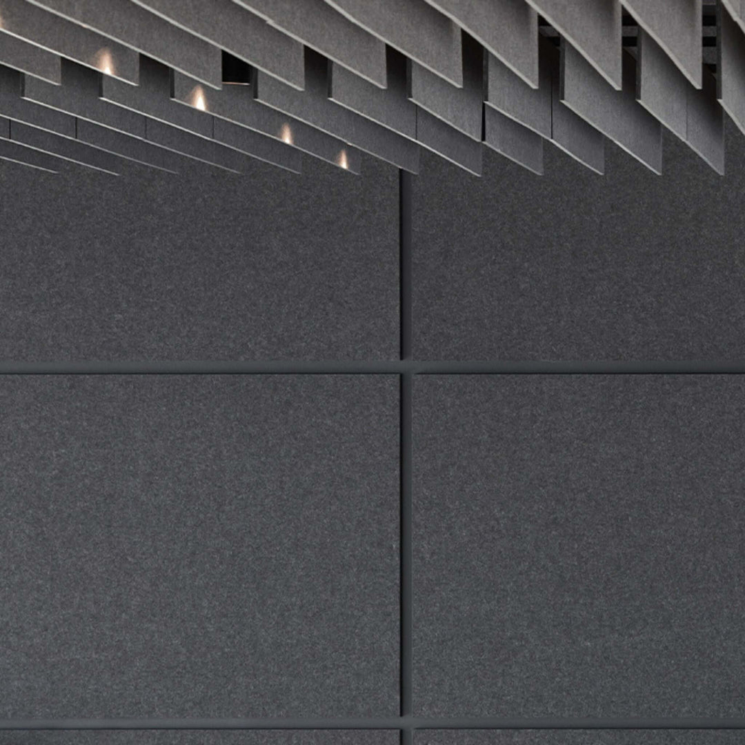 Dark textured wall featuring Autex Cube™ Acoustic Panels for superior sound absorption and modern interior design.