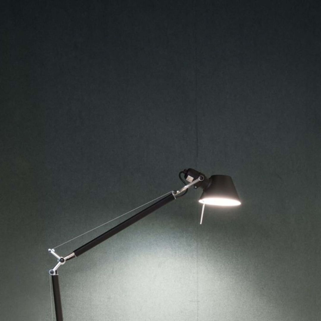 Modern desk lamp illuminating a Symphony acoustic wallcovering backdrop in a stylish workspace.