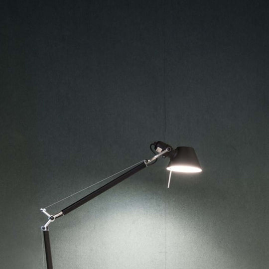 Modern desk lamp illuminating a Symphony acoustic wallcovering backdrop in a stylish workspace.