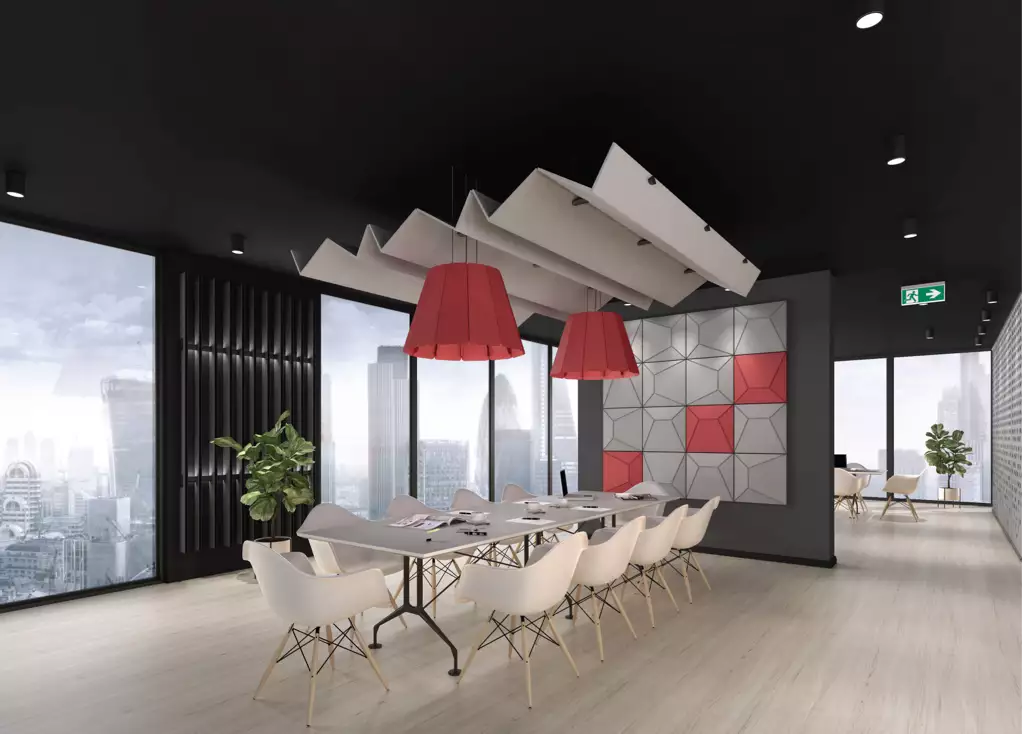 Modern conference room with stylish furniture, bright red pendant lights, and large windows showcasing a city skyline.