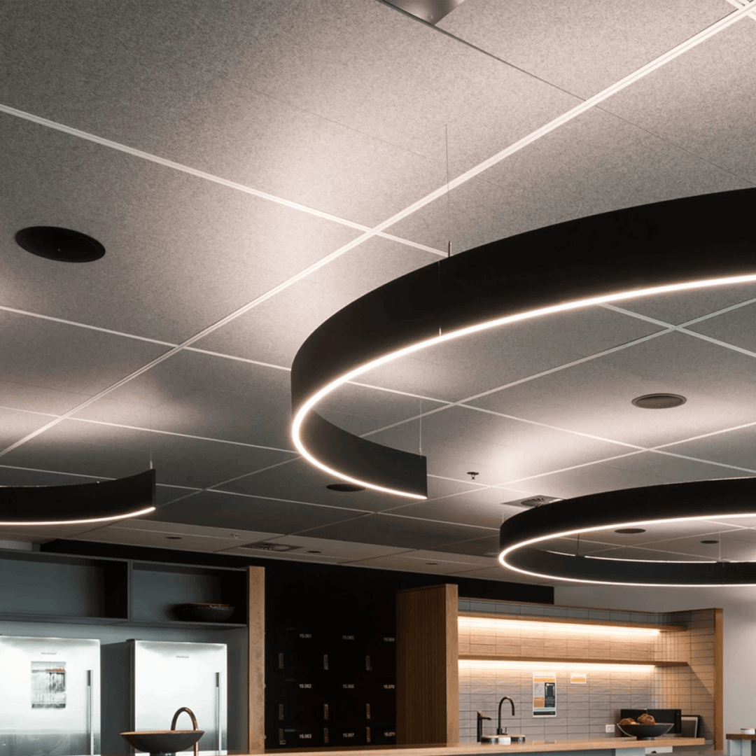 Modern office ceiling design with Autex Accent Ceiling Tiles and stylish lighting features.