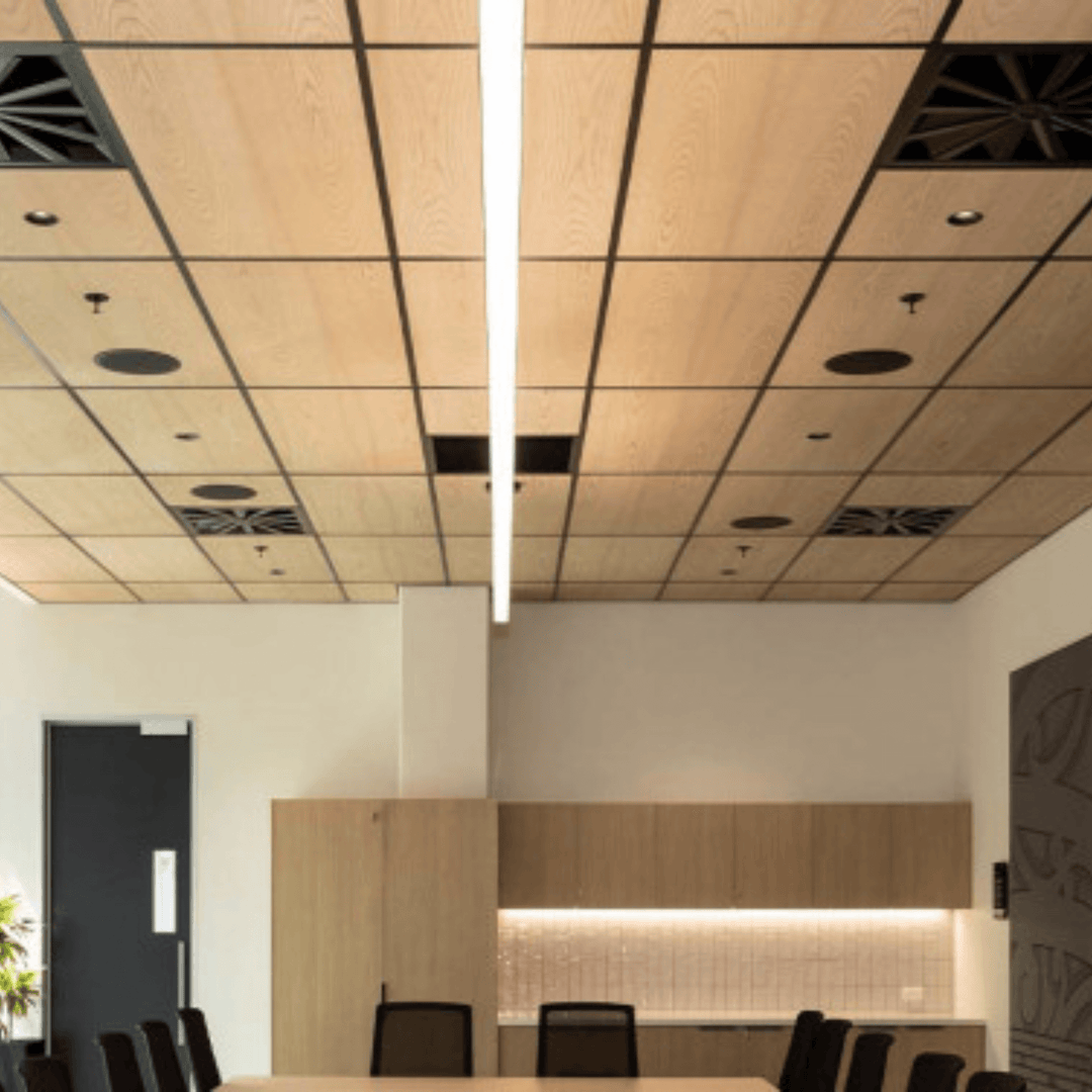 Modern office space featuring Autex Acoustic Timber Ceiling Tiles with woodgrain design and integrated lighting.