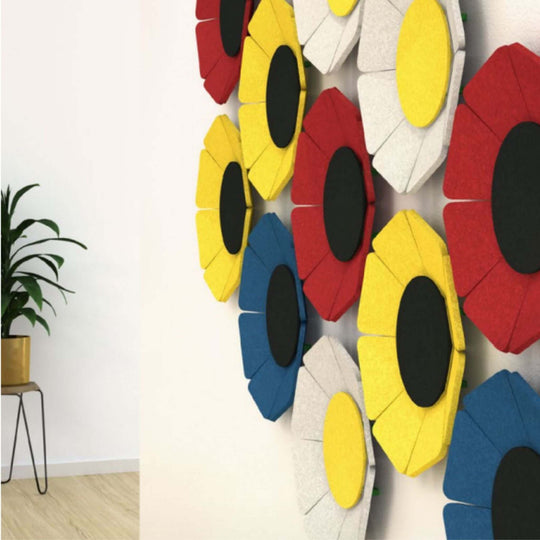 Colorful Acoustek WallFlower 3D acoustic wall panels mounted on a white wall, enhancing aesthetics and sound absorption.