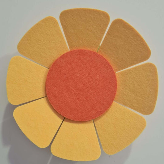 Floral-shaped acoustic wall panel in shades of yellow and orange, designed for sound absorption and decorative appeal.